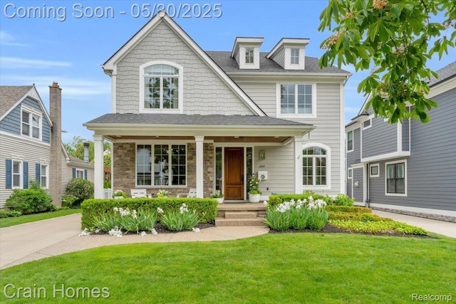 499 Catalpa Dr, Birmingham, MI 48009 - view of front of house featuring a front lawn, covered porch, and stone siding