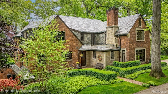 401 Dunston Rd, Bloomfield Hills, MI 48304 - english style home with a high end roof, stone siding, and a chimney