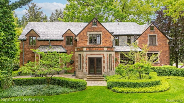 401 Dunston Rd, Bloomfield Hills, MI 48304 - english style home featuring french doors, a high end roof, brick siding, and a front yard