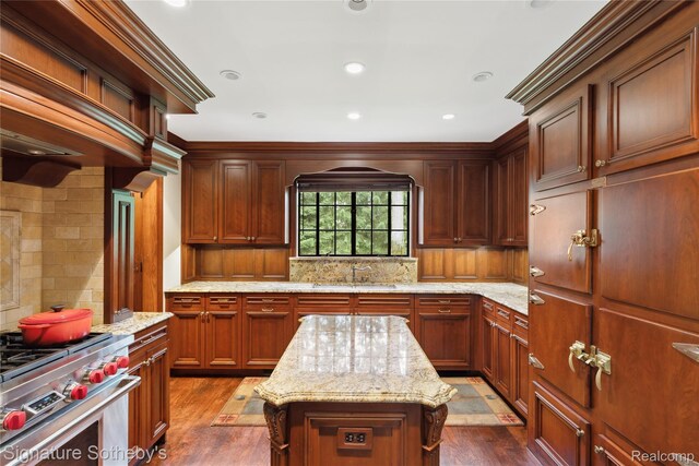 401 Dunston Rd, Bloomfield Hills, MI 48304 - kitchen with a sink, stainless steel stove, decorative backsplash, dark wood-type flooring, and light stone countertops
