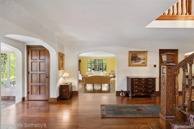 401 Dunston Rd, Bloomfield Hills, MI 48304 - entrance foyer featuring hardwood / wood-style flooring, stairway, arched walkways, and baseboards