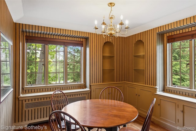 401 Dunston Rd, Bloomfield Hills, MI 48304 - dining space featuring plenty of natural light, a chandelier, radiator heating unit, and built in features