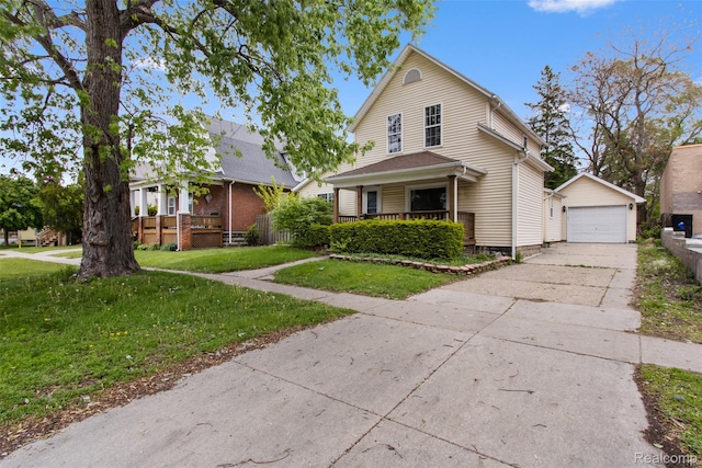 1914 10th St, Port Huron, MI 48060 - view of front of house featuring an outdoor structure, a detached garage, a front lawn, driveway, and a porch