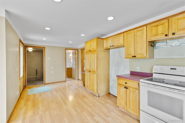 1914 10th St, Port Huron, MI 48060 - kitchen featuring white electric range, light wood finished floors, recessed lighting, and dark countertops