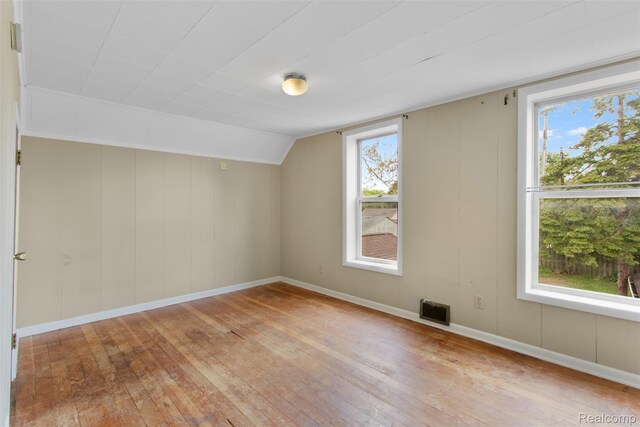 1914 10th St, Port Huron, MI 48060 - additional living space featuring light wood-type flooring, lofted ceiling, and baseboards