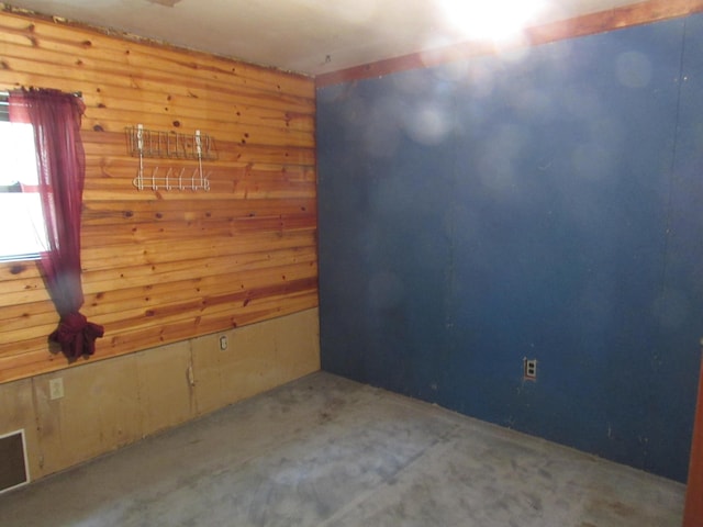 814 Ira Ave, Kalamazoo, MI 49048 - spare room featuring wood walls