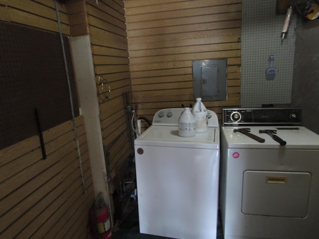 814 Ira Ave, Kalamazoo, MI 49048 - laundry area with separate washer and dryer, electric panel, and wood walls