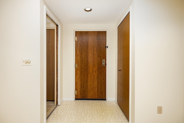 2125208 Nature Cove Ct, Ann Arbor, MI 48104 - corridor with baseboards and brick patterned floors