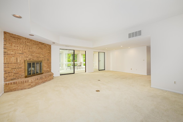 2125208 Nature Cove Ct, Ann Arbor, MI 48104 - unfurnished living room with carpet flooring, a brick fireplace, baseboards, and recessed lighting
