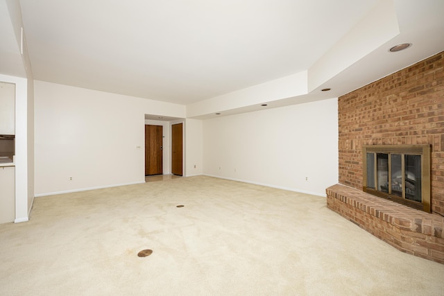 2125208 Nature Cove Ct, Ann Arbor, MI 48104 - unfurnished living room with light carpet, baseboards, and a fireplace