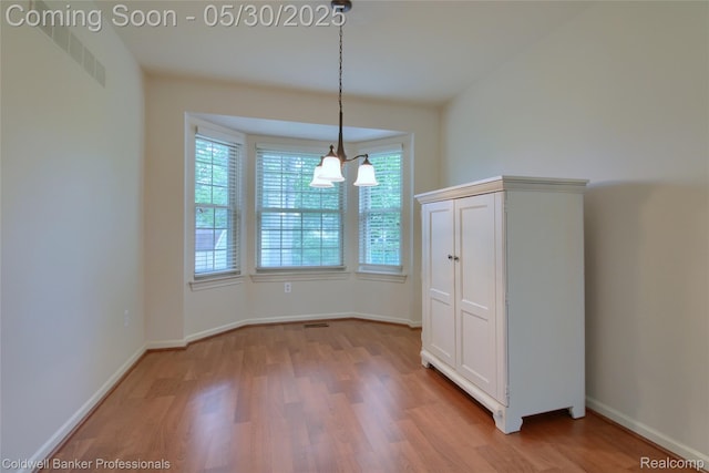 1468 N Morton Taylor Rd, Canton, MI 48187 - unfurnished dining area with light wood-style flooring and baseboards