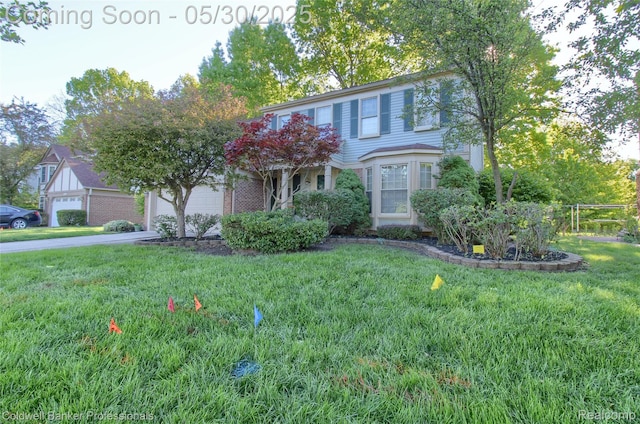 1468 N Morton Taylor Rd, Canton, MI 48187 - view of front of house featuring a front yard, a garage, and driveway
