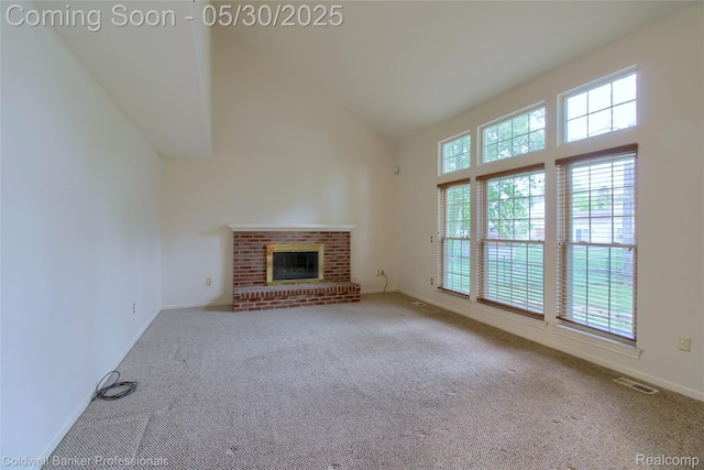 1468 N Morton Taylor Rd, Canton, MI 48187 - unfurnished living room featuring carpet floors, high vaulted ceiling, a brick fireplace, and baseboards