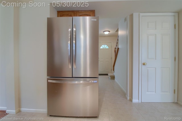 1468 N Morton Taylor Rd, Canton, MI 48187 - kitchen with freestanding refrigerator, brown cabinets, light tile patterned floors, and baseboards