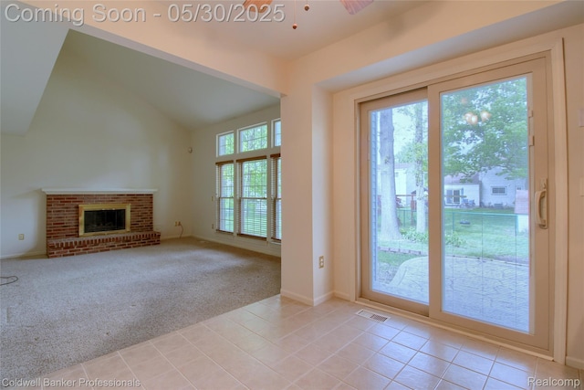 1468 N Morton Taylor Rd, Canton, MI 48187 - doorway to outside with light tile patterned floors, light carpet, vaulted ceiling, a fireplace, and baseboards