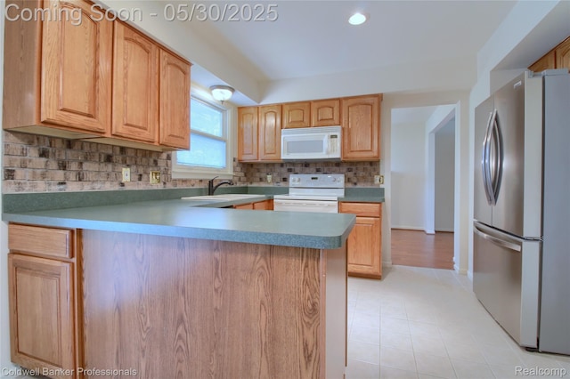 1468 N Morton Taylor Rd, Canton, MI 48187 - kitchen featuring white appliances, a sink, light tile patterned floors, backsplash, and a peninsula