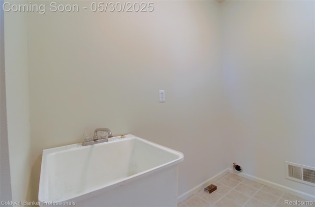 1468 N Morton Taylor Rd, Canton, MI 48187 - laundry room with baseboards and light tile patterned flooring