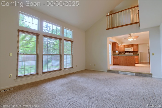 1468 N Morton Taylor Rd, Canton, MI 48187 - unfurnished living room with high vaulted ceiling, plenty of natural light, and baseboards