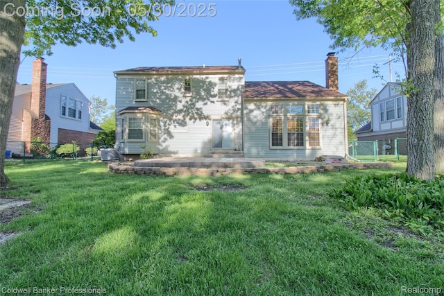 1468 N Morton Taylor Rd, Canton, MI 48187 - rear view of house featuring a patio area and a chimney