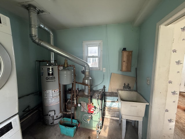 21338 Orchard Lake Rd, Farmington Hills, MI 48336 - utilities featuring stacked washing machine and dryer, water heater, and a sink