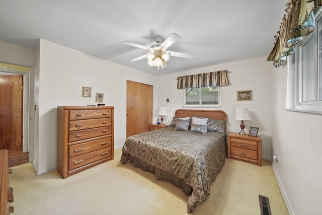 2074 Campbell Dr, Jackson, MI 49202 - bedroom featuring light colored carpet, a closet, baseboards, and ceiling fan