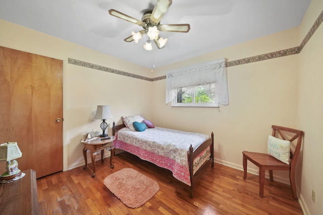 2074 Campbell Dr, Jackson, MI 49202 - bedroom with wood finished floors, baseboards, and a ceiling fan
