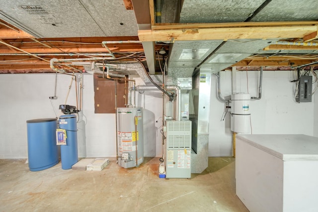 2074 Campbell Dr, Jackson, MI 49202 - unfinished below grade area with water heater, a water softener, electric panel, white fridge, and a central vacuum unit