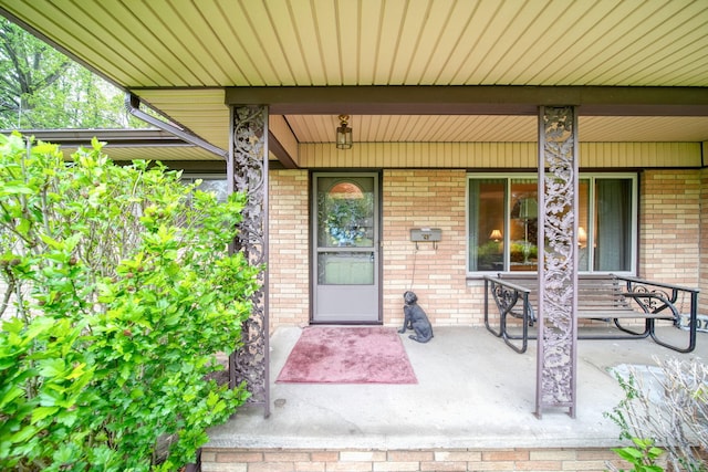 2074 Campbell Dr, Jackson, MI 49202 - entrance to property featuring covered porch and brick siding