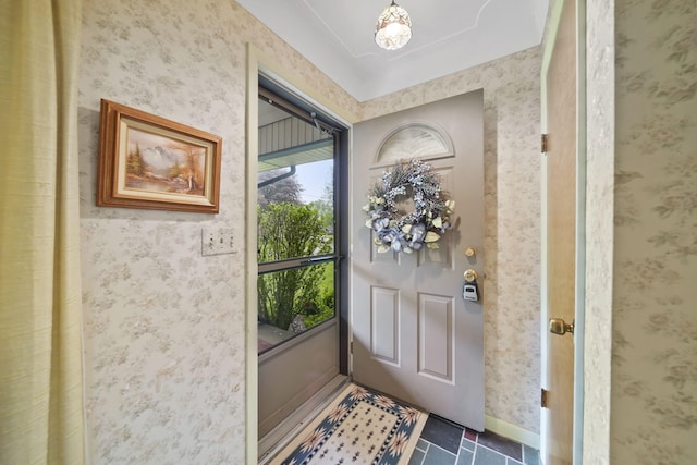 2074 Campbell Dr, Jackson, MI 49202 - foyer with wallpapered walls and baseboards