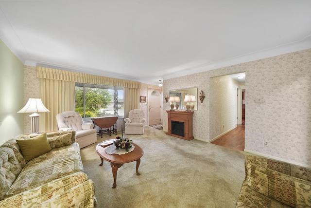 2074 Campbell Dr, Jackson, MI 49202 - living area featuring wallpapered walls, ornamental molding, carpet, baseboards, and a fireplace