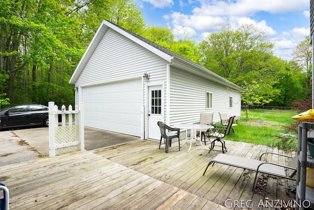5906 Henry St, Norton Shores, MI 49441 - wooden deck with a garage and outdoor dining area