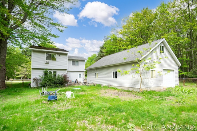 5906 Henry St, Norton Shores, MI 49441 - back of house with a garage
