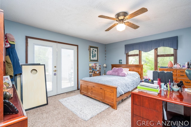 5906 Henry St, Norton Shores, MI 49441 - bedroom featuring access to outside, french doors, light carpet, a textured ceiling, and a ceiling fan