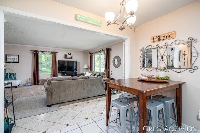 5906 Henry St, Norton Shores, MI 49441 - living area with a chandelier, ornamental molding, and light tile patterned flooring