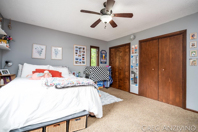 5906 Henry St, Norton Shores, MI 49441 - carpeted bedroom with two closets and a ceiling fan