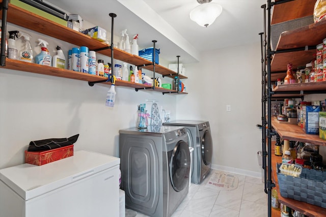 10200 Jerome Rd N, Jerome, MI 49249 - washroom featuring washing machine and clothes dryer and light marble finish floors