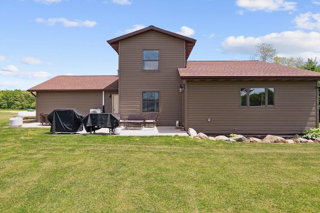 10200 Jerome Rd N, Jerome, MI 49249 - back of house with a patio, a lawn, and a shingled roof
