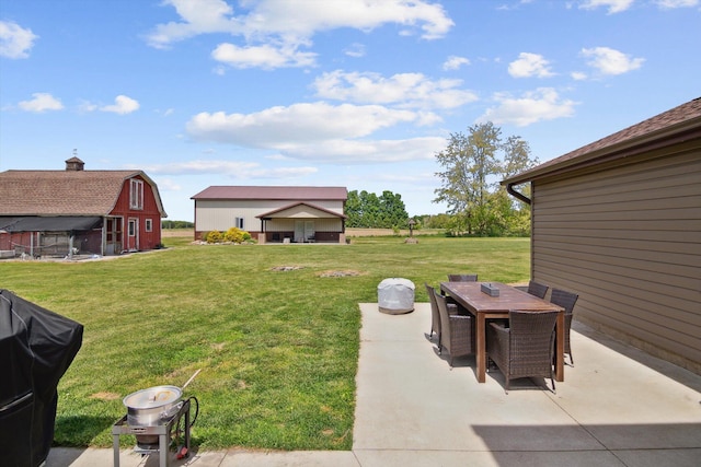 10200 Jerome Rd N, Jerome, MI 49249 - view of grassy yard with a patio area and outdoor dining space
