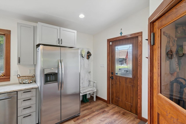 10200 Jerome Rd N, Jerome, MI 49249 - kitchen featuring stainless steel appliances, light wood finished floors, light countertops, baseboards, and recessed lighting