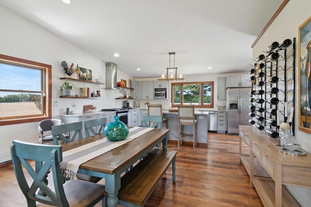 10200 Jerome Rd N, Jerome, MI 49249 - dining space with wood finished floors, a chandelier, and recessed lighting