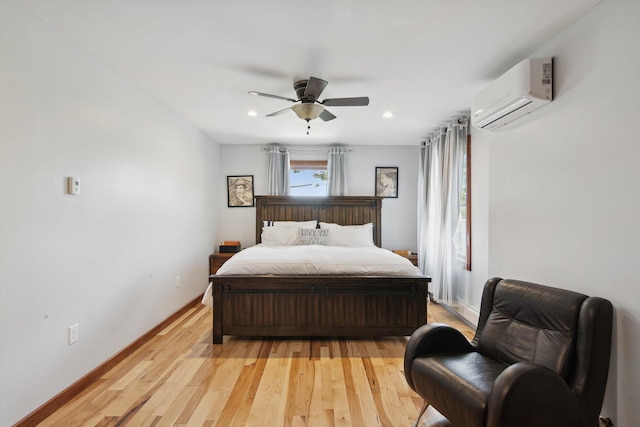 10200 Jerome Rd N, Jerome, MI 49249 - bedroom featuring a wall mounted AC, light wood-type flooring, a ceiling fan, baseboards, and recessed lighting