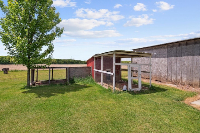 10200 Jerome Rd N, Jerome, MI 49249 - view of green lawn with exterior structure and an outbuilding