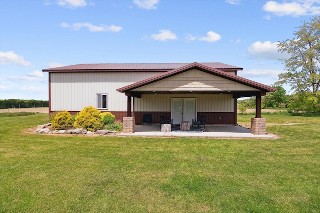 10200 Jerome Rd N, Jerome, MI 49249 - back of house with a lawn and a patio