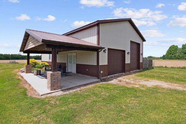 10200 Jerome Rd N, Jerome, MI 49249 - back of house featuring a lawn and a patio
