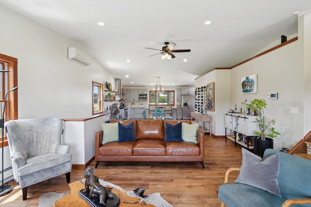 10200 Jerome Rd N, Jerome, MI 49249 - living room featuring a wall mounted air conditioner, recessed lighting, a ceiling fan, light wood finished floors, and lofted ceiling