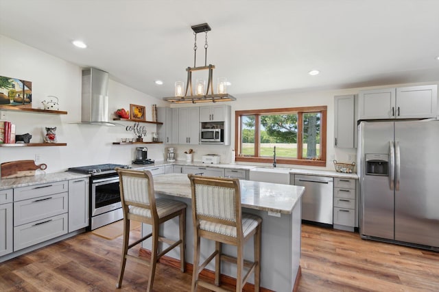 10200 Jerome Rd N, Jerome, MI 49249 - kitchen with appliances with stainless steel finishes, open shelves, wall chimney exhaust hood, a sink, and gray cabinetry