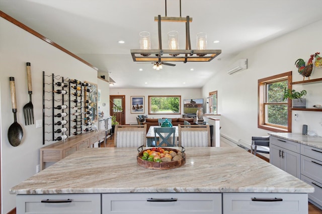 10200 Jerome Rd N, Jerome, MI 49249 - kitchen featuring open shelves, a wall mounted air conditioner, a ceiling fan, light stone counters, and recessed lighting