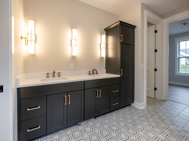 2750 Ashford Trl, Portage, MI 49024 - bathroom featuring baseboards and double vanity
