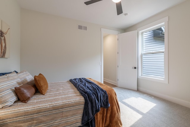 2750 Ashford Trl, Portage, MI 49024 - carpeted bedroom with baseboards and ceiling fan