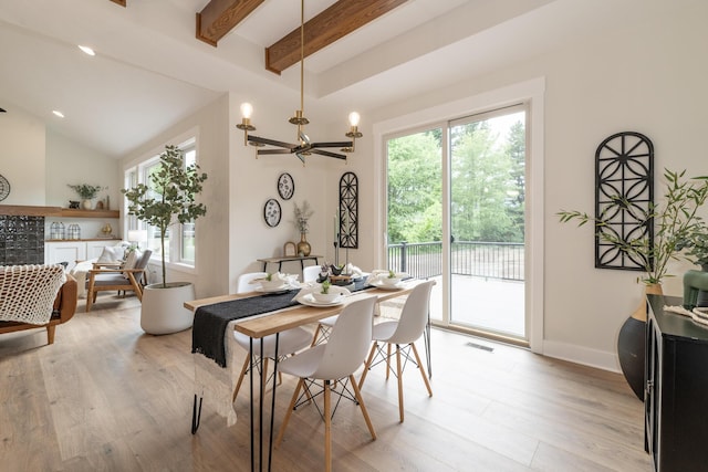 2750 Ashford Trl, Portage, MI 49024 - dining room with healthy amount of natural light, light wood-style floors, a chandelier, and beamed ceiling